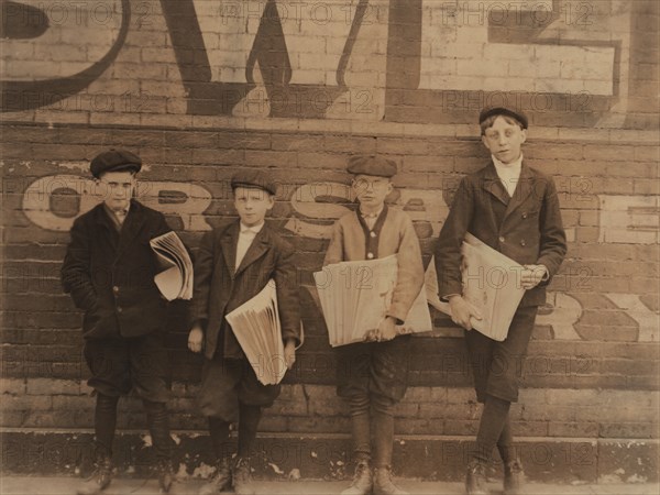 Four Truant Newsboys Selling Newspapers during School, Jefferson Street near Washington, St. Louis, Missouri, USA, Lewis Hine for National Child Labor Committee, May 1910