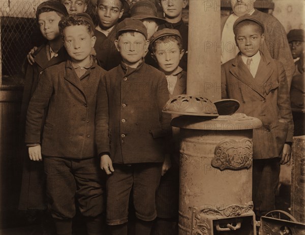 Group of Young Newsboys at 5:00 a.m. on Sunday Getting Ready to Sell Newspapers from McIntyre's Branch, Chestnut and 16th Streets, St. Louis, Missouri, USA, Lewis Hine for National Child Labor Committee, May 1910