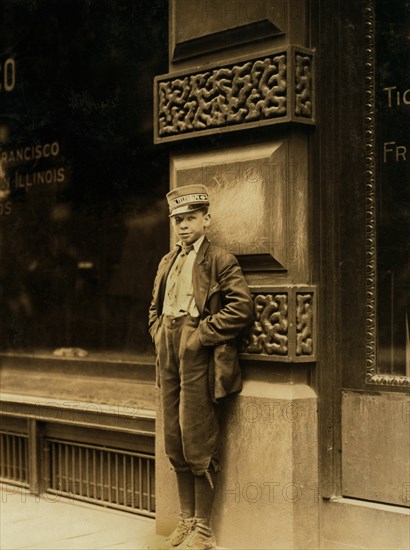 Young Messenger, Full-Length Portrait Standing Against Building, St. Louis, Missouri, USA, Lewis Hine for National Child Labor Committee, May 1910