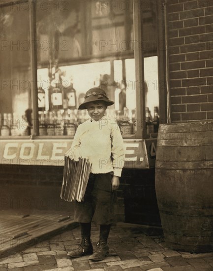 James Morgan, 9-year-old Newsboy, Selling Newspapers for 4 years, Works 6 hours per Day, Visits Saloons, Full-Length Portrait, Wilmington, Delaware, USA, Lewis Hine for National Child Labor Committee, May 1910