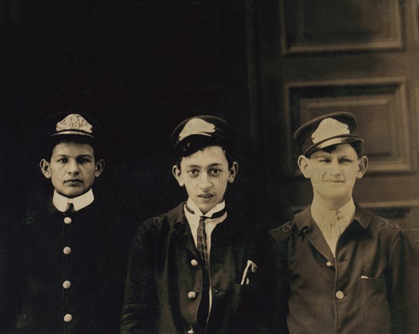 Three Typical A.D.T. Boys, Half-Length Portrait, Broadway near 40th Street, New York City, New York, USA, Lewis Hine for National Child Labor Committee, July 1910