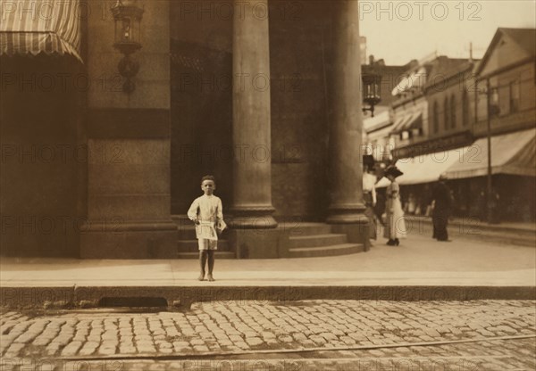 Young Newsboy, Full-Length Portrait Standing in Bare Feet on Sidewalk, New Bedford, Massachusetts, USA, Lewis Hine for National Child Labor Committee, August 1911