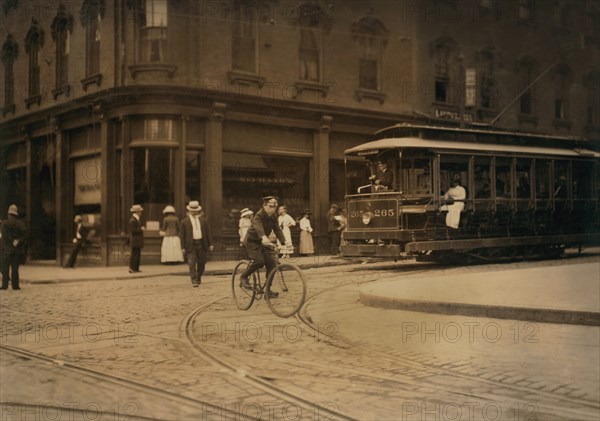 Young Messenger Riding Bicycle, New Bedford, Massachusetts, USA, Lewis Hine for National Child Labor Committee, August 1911