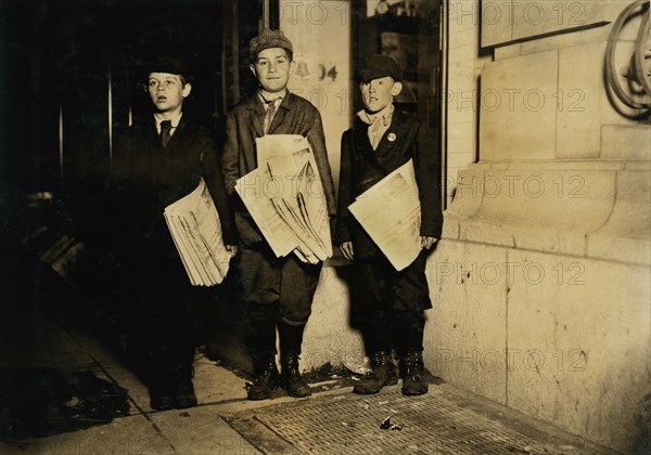 Lawrence Lee, 10 years old, Michael Nyland, 11 years old, Martin Garvin, 12 years old, Full-Length Portrait Selling Newspapers near 14th after Midnight, All vowing to stay until all newspapers were sold, Washington DC, USA, Lewis Hine for National Child Labor Committee, April 1912
