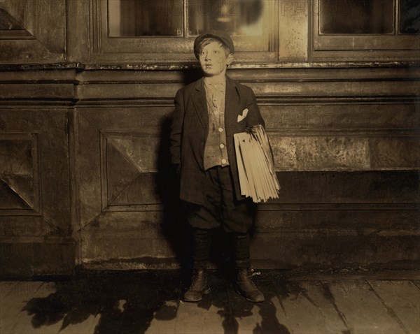 Joseph Weiss, 11-year-old Newsboy, Full-Length Portrait Selling Newspapers Late at Night, Newark, New Jersey, USA, Lewis Hine for National Child Labor Committee, December 1912