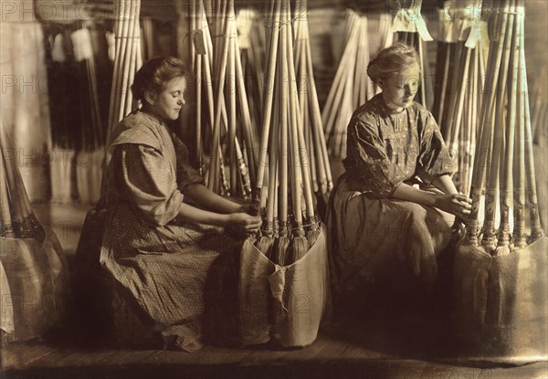 Two Girls Packing Brooms in Packing Department, S.W. Brown Manufacturing Company, Evansville, Indiana, USA, Lewis Hine for National Child Labor Committee, October 1908
