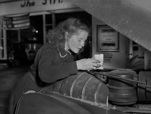 Virginia Excell, formerly a Butcher, now a Service Station Attendant as new Jobs have opened up for Women during WWII, Checking Car Engine, East Liverpool, Ohio, USA, Ann Rosener, Office of War Information, September 1942