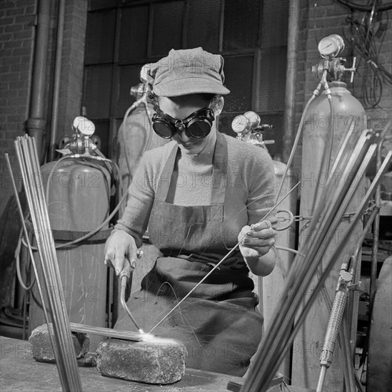 Young Woman Learning to Weld, Six Nights per Week, at Work Projects Administration (WPA) Vocational School in Preparation to Work on Assembly Line in a War Plant, Washington DC, USA, Howard Liberman for Office of War Information, July 1942