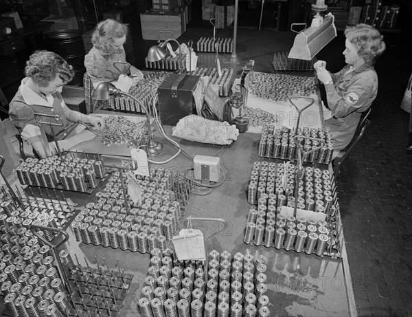 Three Female Workers Inspecting Tappet Rollers for Airplane Motors at Manufacturing Plant, Pratt & Whitney, East Hartford, Connecticut, USA, Andreas Feininger for Office of War Information, June 1942