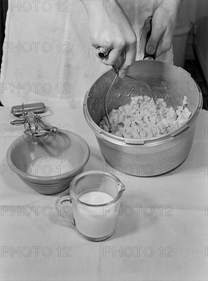 Woman Mashing Cooked Beans while Making Baked Bean Loaf, a Nourishing and Healthy Meat Substitute, Ann Rosener for Office of War Information, October 1942