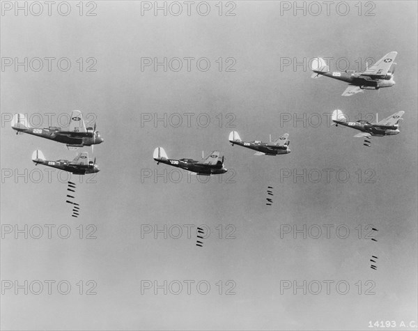 600-pound Bombs falling from Formation of B-10 Bombers in Bombing Practice by 19th Bombardment Group, U.S. Army Air Corps, Office of War Information, early 1940's