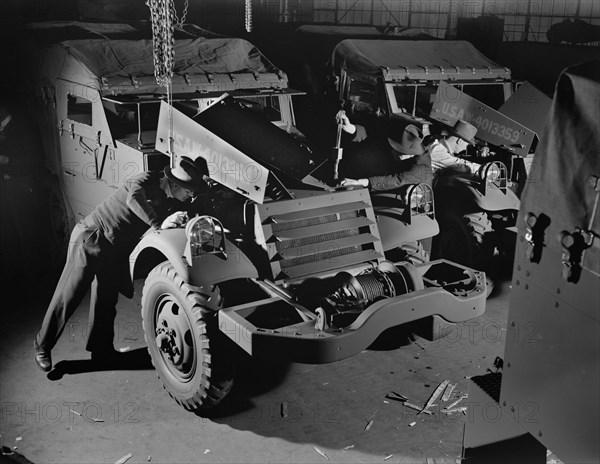 Army's Half-Track Scout Cars Being Inspected before Delivery from Factory Converted to War Production, White Motor Company, Cleveland, Ohio, USA, Alfred T. Palmer for Office of War Information, December 1941