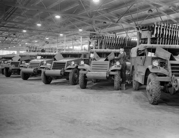 Army's Half-Track Scout Cars Ready for Delivery from Factory Converted to War Production, White Motor Company, Cleveland, Ohio, USA, Alfred T. Palmer for Office of War Information, December 1941