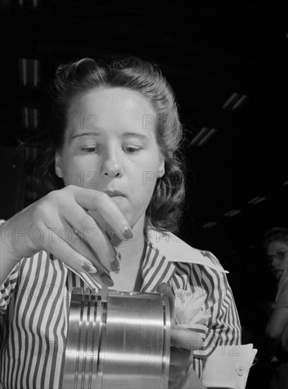 Anne Weinman, 22 years old, Inspecting Pistons to be used in Military Aircraft Engines at Buick Plant Converted for War Product Production, Melrose Park, Illinois, USA, Ann Rosener, Office of War Information, July 1942