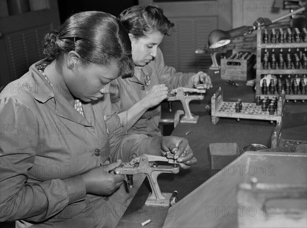 Two Female Factory Workers Reconditioning used Spark Plugs to be re-used in Testing Military Aircraft Motors at Buick Plant Converted for War Product Production, Melrose Park, Illinois, USA, Ann Rosener, Office of War Information, July 1942