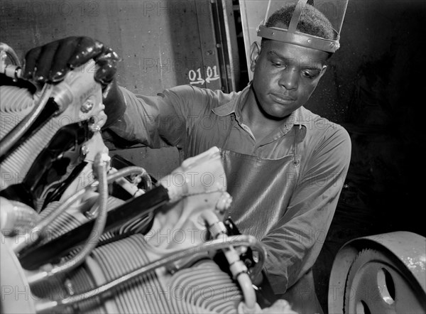 Factory Worker Washing Airplane Motor Prior to Shipment at Buick Plant Converted for War Product Production, Melrose Park, Illinois, USA, Ann Rosener, Office of War Information, July 1942