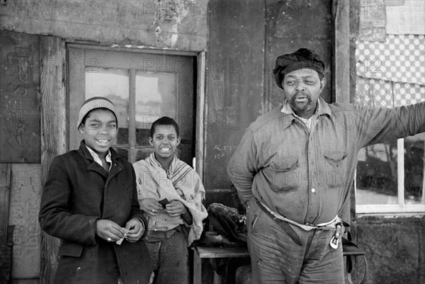 Family on Porch of home in Subdivision, part of Government Resettlement Program, Bound Brook, New Jersey, USA, Carl Mydans, U.S. Resettlement Administration, February 1936