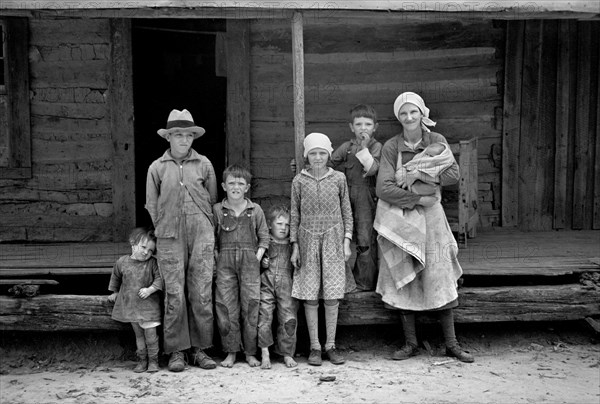 Portrait of Family in Front of Rural Cabin on Natchez Trace Project, near Lexington, Tennessee, USA, Carl Mydans for U.S. Resettlement Administration, March 1936