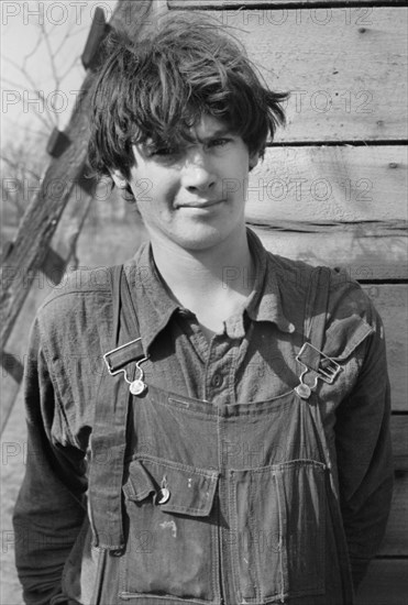 Oldest Boy of Family of Nine, Seventeen Years Old, Claims Two Years Schooling, Living with his Family in Open Field, on U.S. Route 70 between Camden and Bruceton, Tennessee, USA, Carl Mydans for U.S. Resettlement Administration, March 1936