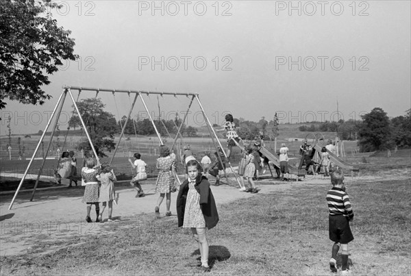 Children Playing at School Playground, Greenhills, Ohio, USA, a Greenbelt Community Constructed by U.S. Department of Agriculture as Part of President Franklin Roosevelt's New Deal, John Vachon for U.S. Resettlement Administration, October 1938