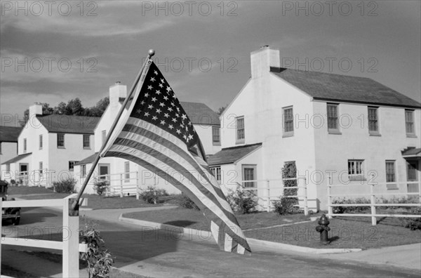 American Flag, Labor Day, Greendale, Wisconsin, USA, a Greenbelt Community Constructed by U.S. Department of Agriculture as Part of President Franklin Roosevelt's New Deal, John Vachon for U.S. Resettlement Administration, September 1939