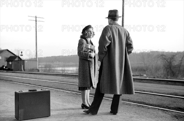 Couple Waiting for Train to Minneapolis, East Dubuque, Illinois, USA, John Vachon for Farm Security Administration, April 1940