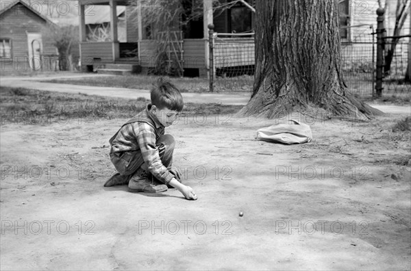 Boy Shooting Marbles, Woodbine, Iowa, USA, John Vachon for Farm Security Administration, May 1940