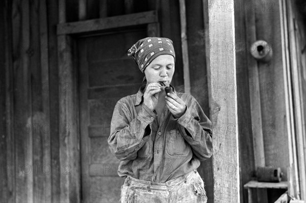 Wife of Ozark Mountains Farmer Smoking Pipe, Missouri, USA, John Vachon for Farm Security Administration, May 1940