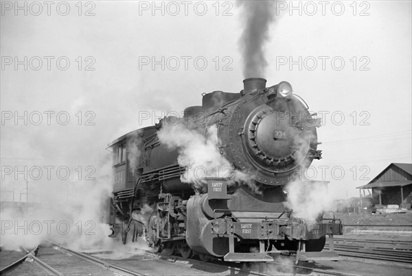 Locomotive in Railway Yard along River, St. Louis, Missouri, USA, Arthur Rothstein for Farm Security Administration, January 1939