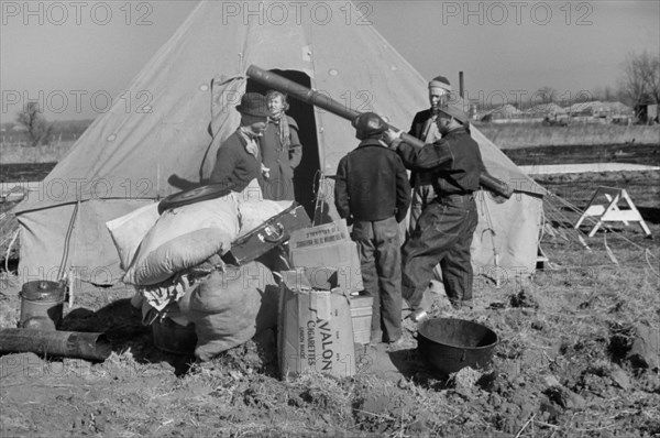 Family of Flood Refugees and their Salvaged Goods in Camp, Forrest City, Arkansas, USA, Edwin Locke for U.S. Resettlement Administration, February 1937