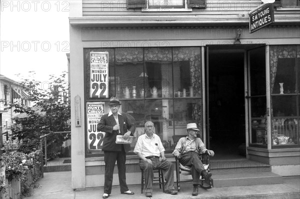Three Men Relaxing in front of Antiques Shop, Provincetown, Massachusetts, USA, Edwin Rosskam for Farm Security Administration, August 1940