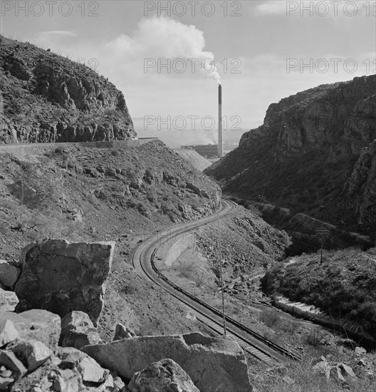 Industrial Railroad and Smokestack of Large Copper Smelter that Supplies Great Quantities of Copper so vital to War Effort, Phelps-Dodge Mining Company, Morenci, Arizona, USA, Fritz Henle for Office of War Information, December 1942