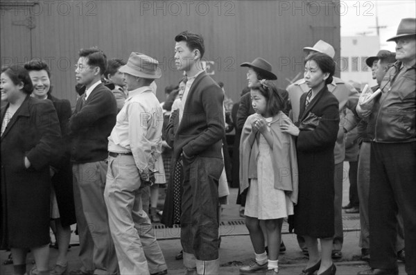 Japanese-Americans Waiting for Train to Owens Valley During Evacuation of Japanese-Americans from West Coast Areas under U.S. Army War Emergency Order, Los Angeles, California, USA, Russell Lee, Office of War Information, April 1942