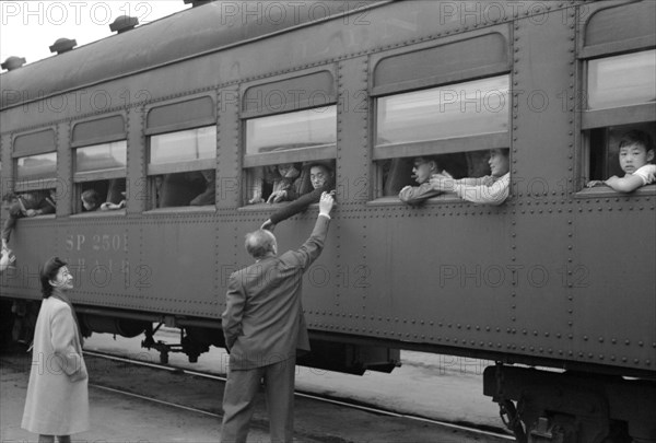 Japanese-Americans on Train to Owens Valley During Evacuation of Japanese-Americans from West Coast Areas under U.S. Army War Emergency Order, Los Angeles, California, USA, Russell Lee, Office of War Information, April 1942