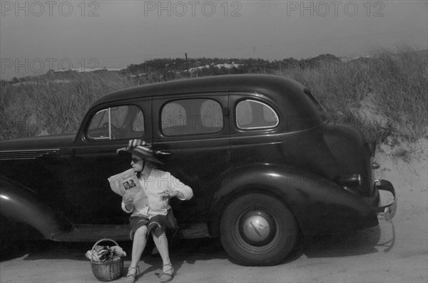 Woman Relaxing on Car at Beach, Provincetown, Massachusetts, USA, Edwin Rosskam, Farm Security Administration, August 1940