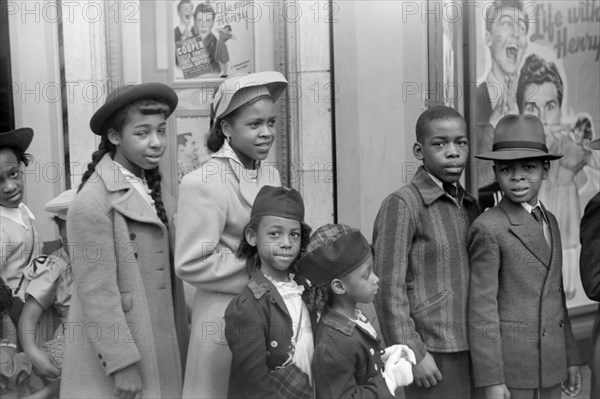 Children in Front of Moving Picture Theater, Easter Sunday Matinee, "Black Belt", Chicago, Illinois, USA, Edwin Rosskam for Office of War Information, April 1941