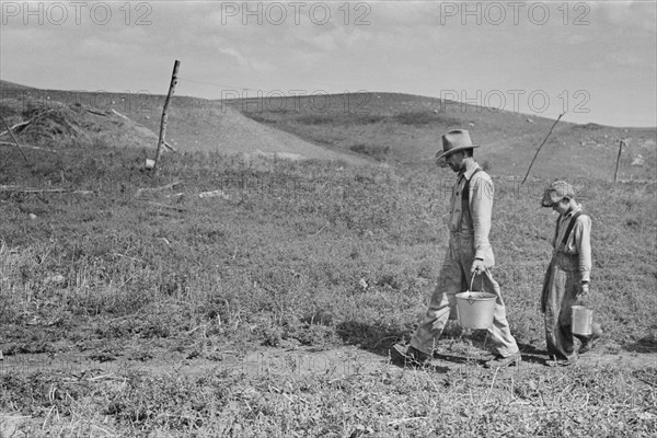William Huravitch and Son Carrying Water to their Home during Drought, Water Source is about a Half Mile Away, Williams County, North Dakota, USA, Russell Lee, U.S. Resettlement Administration, September 1937