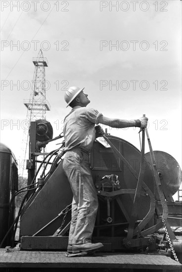 Winch Operator at Oil Well, Oklahoma City, Oklahoma, USA, Russell Lee, Farm Security Administration, August 1939