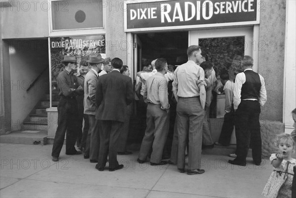 Crowd of Men Listening to World Series Baseball Game at Dixie Radio Service, St. George, Utah, USA, Russell Lee, Farm Security Administration, October 1940