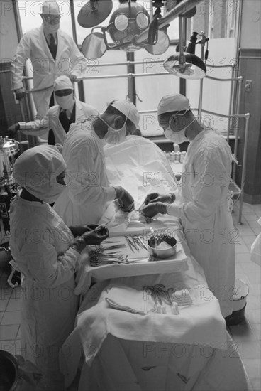 Surgeons Performing Surgery in Operating Room, Provident Hospital, Chicago, Illinois, USA,