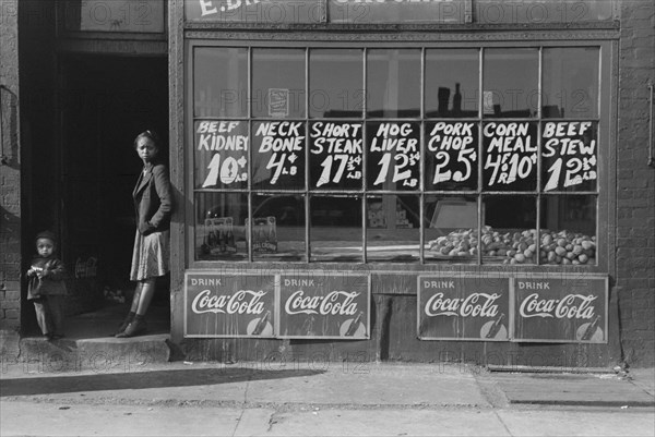 Two Children Standing in Doorway of Grocery Store, South Side, Chicago, Illinois, USA, Russell Lee, Farm Security Administration, April 1941