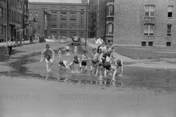 Children Cooling off in Water from Fire Hydrant, Chicago, Illinois, USA, John Vachon, Farm Security Administration, July 1941