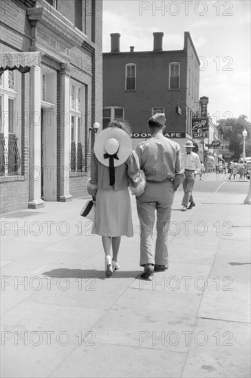 Soldier from Fort Benning and Girlfriend Walking down Sidewalk, Columbus, Georgia, USA, Jack Delano, Office of War Information, May 1941