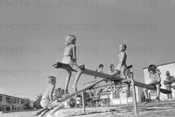 Children on Seesaw at Playground, Greenbelt, Maryland, USA, Marion Post Wolcott, Farm Security Administration, September 1938