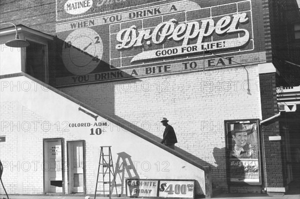 Man Ascending Stairs to "Colored" Entrance of Crescent Theater, Belzoni, Mississippi, USA, Marion Post Wolcott, Farm Security Administration, October 1939