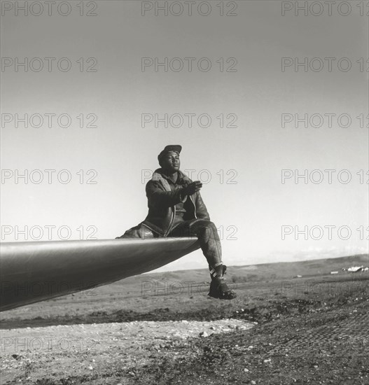 Ground Crewman of the Red-Tailed Mustangs, 332nd Fighter Pilot Squadron, Sitting on Wing to Direct Pilot, Ramitelli, Italy, Toni Frissell, March 1945