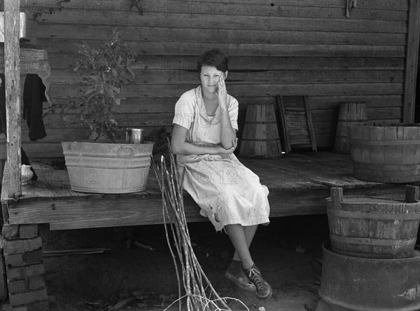Daughter of Farmer who will be Resettled, Portrait sitting on Porch, Wolf Creek Farms, Georgia, USA, Arthur Rothstein, Farm Security Administration, September 1935