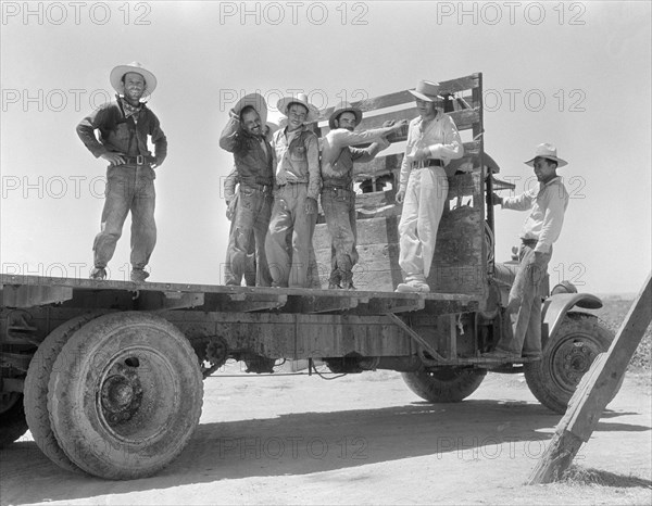 Group of Mexican Laborers on Flatbed Truck after a day in Melon Fields, Imperial Valley, California, USA, Dorothea Lange, Farm Security Administration, June 1935