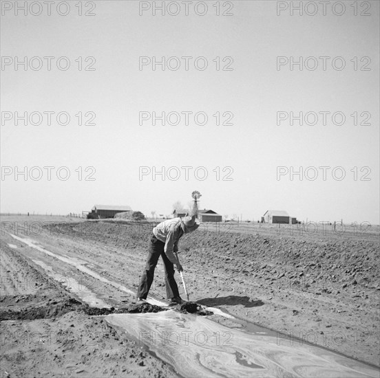 Farmer Fighting Drought and Dust with Irrigation, Cimarron County, Oklahoma, USA, Arthur Rothstein, Farm Security Administration, April 1936