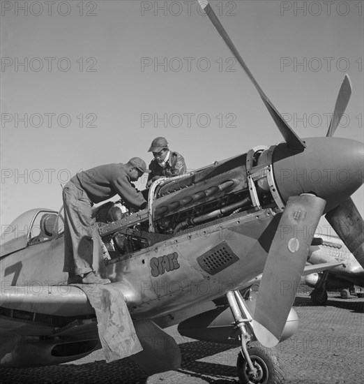 Marcellus G. Smith, Louisville, Kentucky, and Roscoe C. Brown, New York, NY Class 44-C. P-SC#11, working on Airplane Engine, Ramitelli, Italy, Toni Frissell, March 1945